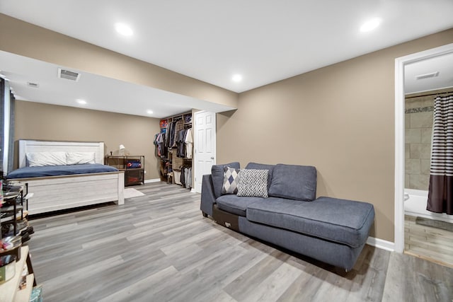 609 W Romeo Rd, Romeoville, IL 60446 - bedroom featuring wood finished floors, ensuite bathroom, a closet, and recessed lighting