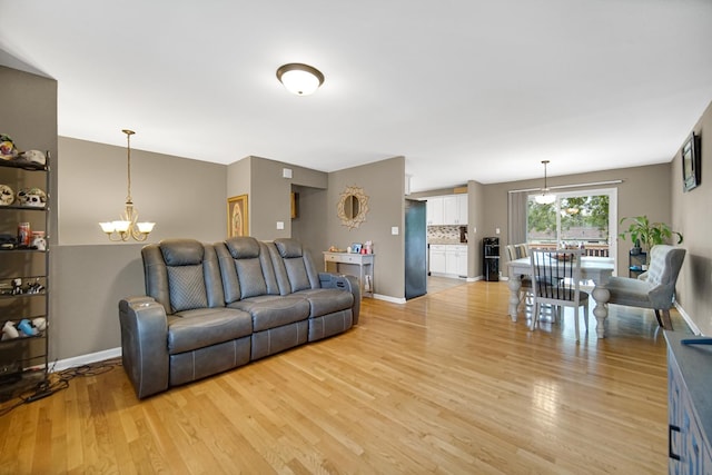 609 W Romeo Rd, Romeoville, IL 60446 - living room with a chandelier and light wood finished floors