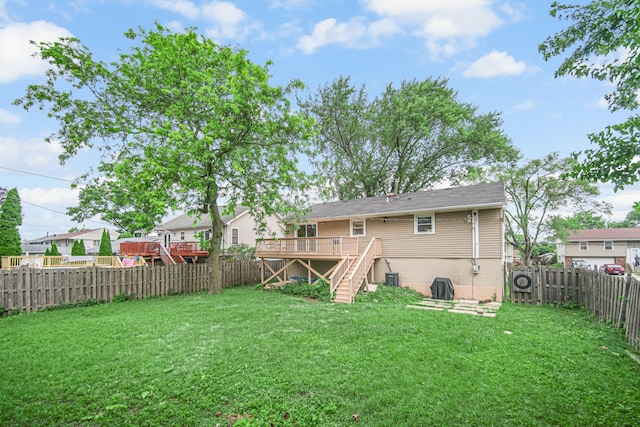 609 W Romeo Rd, Romeoville, IL 60446 - rear view of house with stairs, a wooden deck, and a fenced backyard