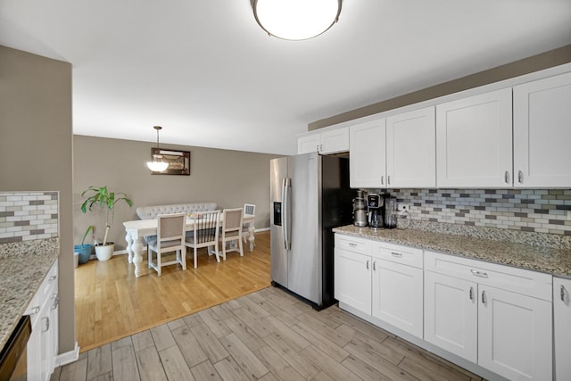 609 W Romeo Rd, Romeoville, IL 60446 - kitchen featuring stainless steel appliances, tasteful backsplash, light wood-type flooring, and white cabinetry
