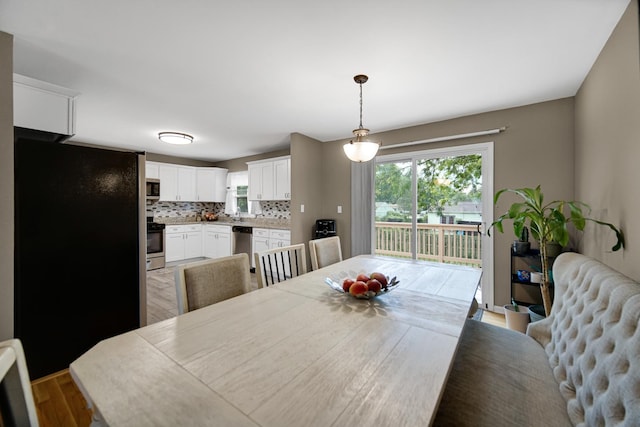 609 W Romeo Rd, Romeoville, IL 60446 - dining area with plenty of natural light and light wood-style flooring