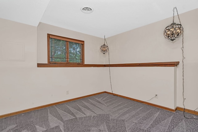 746 Old Stage Rd, Morris, IL 60450 - carpeted spare room with baseboards and a chandelier