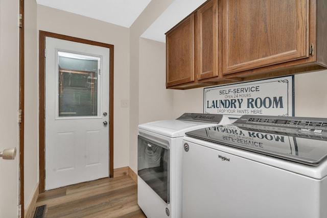 746 Old Stage Rd, Morris, IL 60450 - laundry room with cabinet space, independent washer and dryer, and light wood-type flooring
