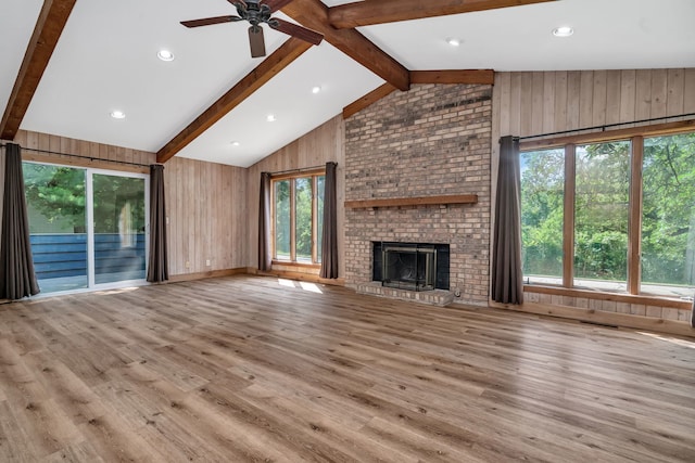 746 Old Stage Rd, Morris, IL 60450 - unfurnished living room with wooden walls, ceiling fan, wood finished floors, a brick fireplace, and recessed lighting