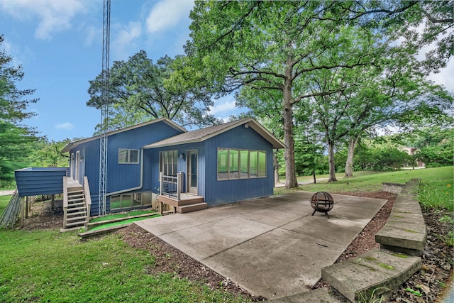 746 Old Stage Rd, Morris, IL 60450 - rear view of house featuring an outdoor fire pit, a lawn, stairway, a wooden deck, and a patio area