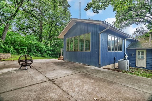 746 Old Stage Rd, Morris, IL 60450 - view of home's exterior featuring a fire pit and a patio