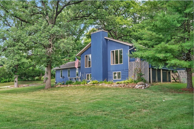 746 Old Stage Rd, Morris, IL 60450 - back of house featuring a lawn and a chimney