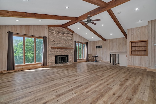 746 Old Stage Rd, Morris, IL 60450 - unfurnished living room with wooden walls, light wood-style floors, a fireplace, ceiling fan, and recessed lighting