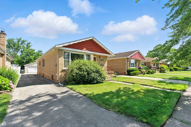 2644 W 94th St, Evergreen Park, IL 60805 - view of front of home with brick siding, an outbuilding, a front yard, and a detached garage
