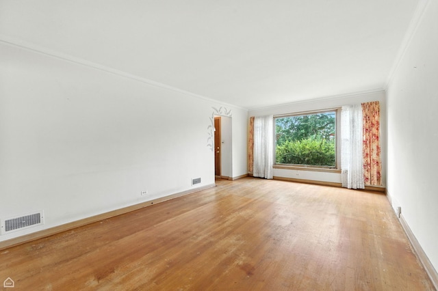 2644 W 94th St, Evergreen Park, IL 60805 - spare room featuring crown molding and light wood-style flooring