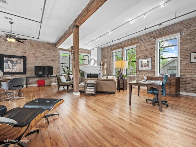 2035 W Charleston St Unit 205, Chicago, IL 60647 - office space with brick wall, rail lighting, wood finished floors, plenty of natural light, and a ceiling fan