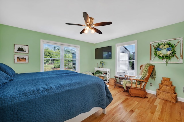 2831 E 28th Rd, Marseilles, IL 61341 - bedroom featuring multiple windows, light wood-style floors, and ceiling fan