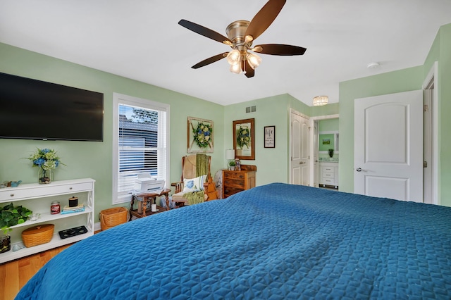 2831 E 28th Rd, Marseilles, IL 61341 - bedroom with ceiling fan, ensuite bath, and wood finished floors