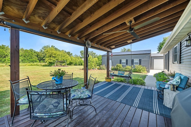 2831 E 28th Rd, Marseilles, IL 61341 - deck with outdoor dining area, a yard, and an outbuilding