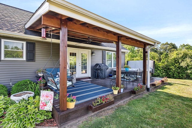2831 E 28th Rd, Marseilles, IL 61341 - wooden deck with french doors, a lawn, grilling area, a ceiling fan, and outdoor dining area
