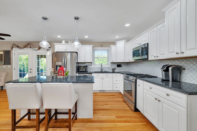 2831 E 28th Rd, Marseilles, IL 61341 - kitchen featuring appliances with stainless steel finishes, a kitchen breakfast bar, white cabinets, and recessed lighting