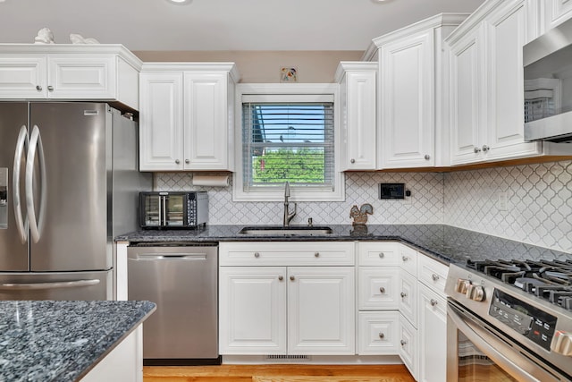 2831 E 28th Rd, Marseilles, IL 61341 - kitchen featuring stainless steel appliances, white cabinets, and tasteful backsplash