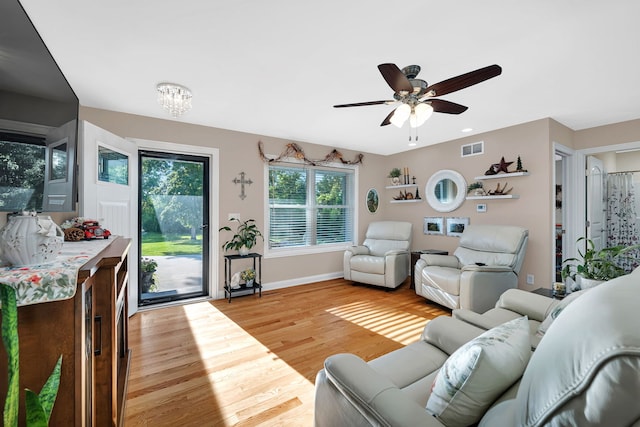 2831 E 28th Rd, Marseilles, IL 61341 - living area featuring light wood finished floors, ceiling fan, and a chandelier