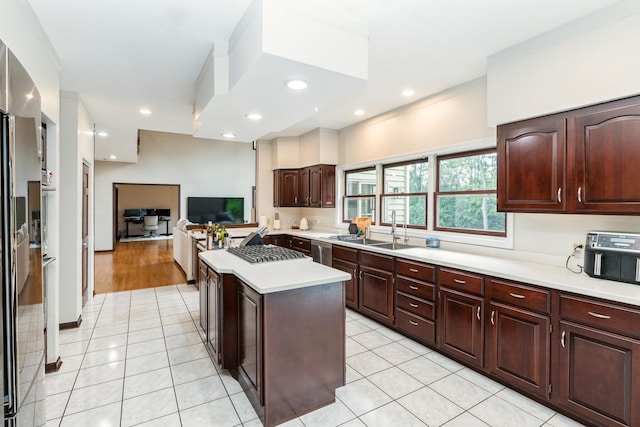 2809 Jenny Jae Ln, Crystal Lake, IL 60012 - kitchen with a center island, light countertops, light tile patterned floors, open floor plan, and recessed lighting