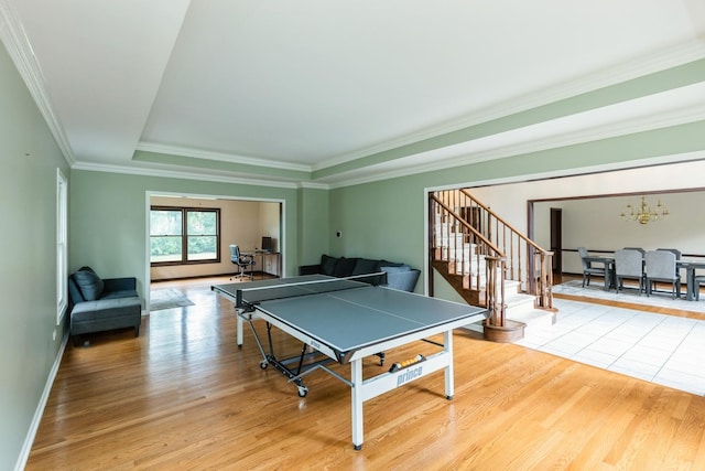 2809 Jenny Jae Ln, Crystal Lake, IL 60012 - game room with light wood-style flooring, a chandelier, a raised ceiling, and crown molding