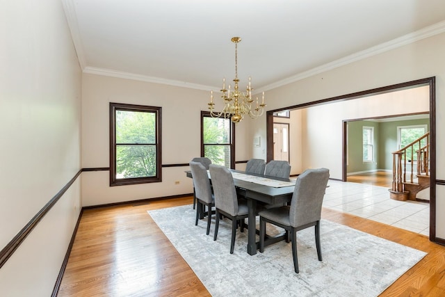 2809 Jenny Jae Ln, Crystal Lake, IL 60012 - dining space featuring a chandelier, light wood-style floors, crown molding, and stairs