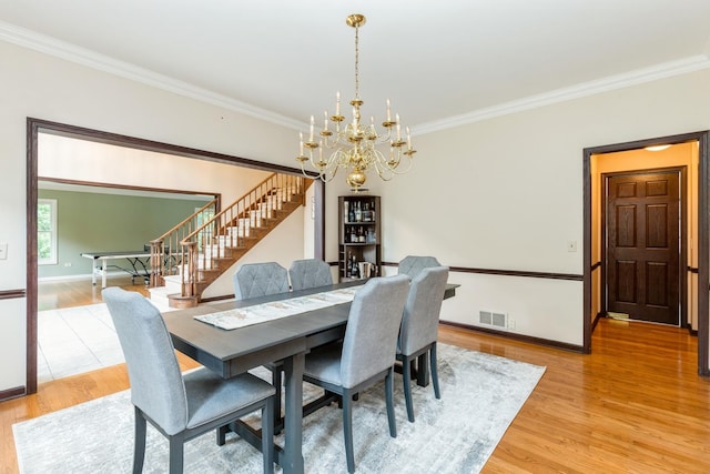 2809 Jenny Jae Ln, Crystal Lake, IL 60012 - dining space featuring ornamental molding, stairs, light wood-style floors, and a chandelier