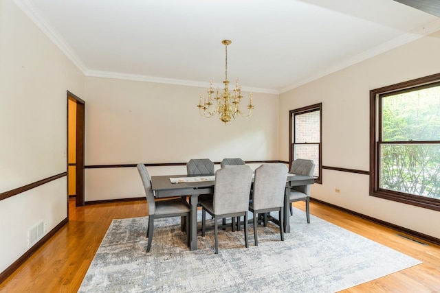 2809 Jenny Jae Ln, Crystal Lake, IL 60012 - dining room featuring a chandelier, ornamental molding, and wood finished floors