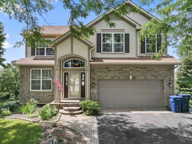 501 Blackstone Ct, Lake Villa, IL 60046 - traditional home with brick siding, driveway, and an attached garage