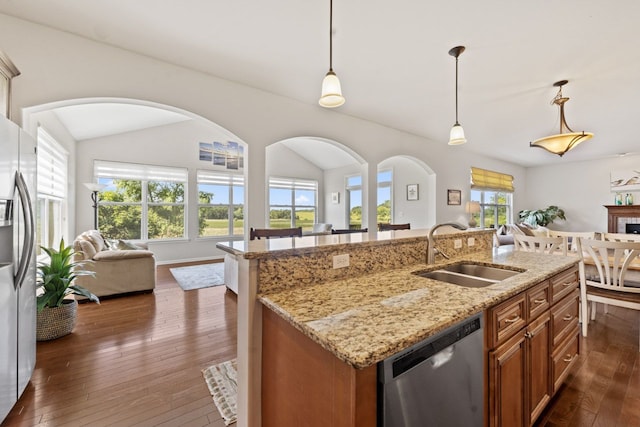 501 Blackstone Ct, Lake Villa, IL 60046 - kitchen with stainless steel appliances, open floor plan, brown cabinets, dark wood-type flooring, and a kitchen island with sink