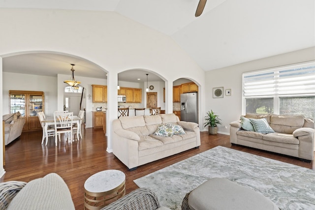 501 Blackstone Ct, Lake Villa, IL 60046 - living area featuring arched walkways, dark wood-style floors, high vaulted ceiling, and a ceiling fan