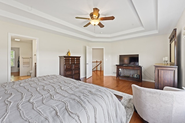501 Blackstone Ct, Lake Villa, IL 60046 - bedroom featuring a tray ceiling, wood finished floors, and ceiling fan