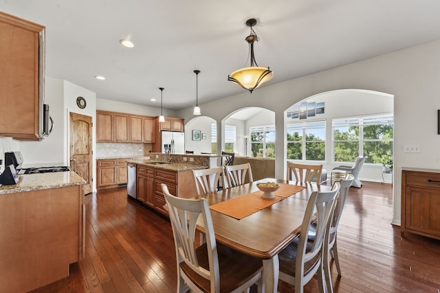 501 Blackstone Ct, Lake Villa, IL 60046 - dining space featuring arched walkways, dark wood finished floors, and recessed lighting