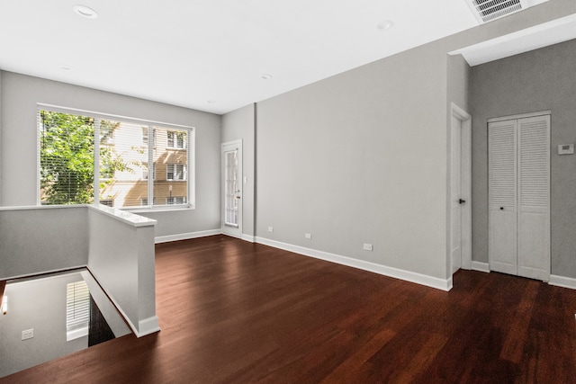 3237 W Sunnyside Ave Unit 1E, Chicago, IL 60625 - empty room with dark wood-style floors and recessed lighting