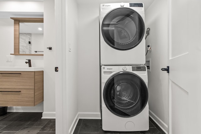 3237 W Sunnyside Ave Unit 1E, Chicago, IL 60625 - laundry area featuring stacked washing machine and dryer and baseboards