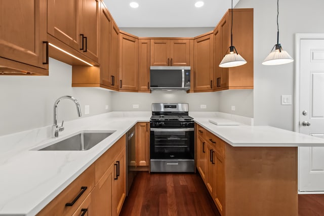 3237 W Sunnyside Ave Unit 1E, Chicago, IL 60625 - kitchen featuring stainless steel appliances, a peninsula, dark wood-style flooring, brown cabinetry, and recessed lighting