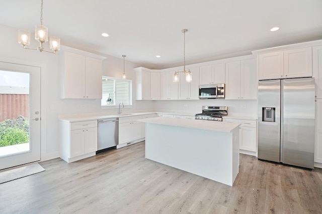 24465 S St Peters Dr, Channahon, IL 60410 - kitchen featuring stainless steel appliances, light countertops, light wood-style floors, white cabinetry, and recessed lighting