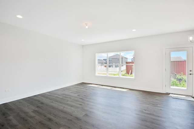 24465 S St Peters Dr, Channahon, IL 60410 - empty room with healthy amount of natural light, dark wood-type flooring, and recessed lighting