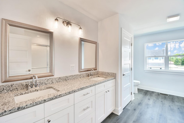 24465 S St Peters Dr, Channahon, IL 60410 - bathroom featuring double vanity and wood finished floors