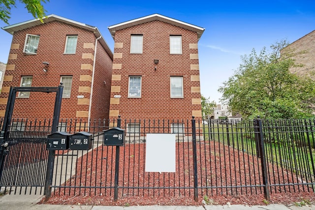 6139 S King Dr, Chicago, IL 60637 - view of front of house featuring brick siding and a gate