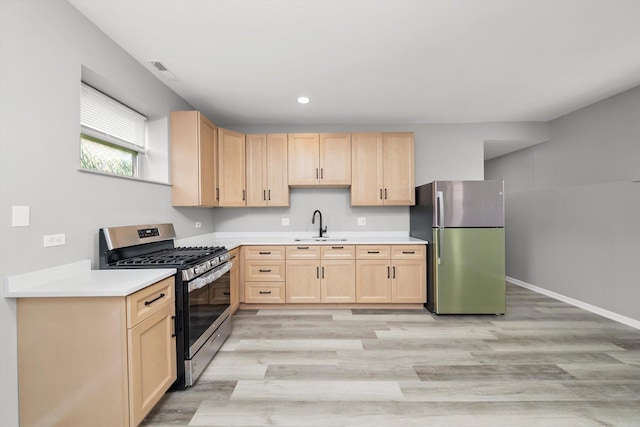 6139 S King Dr, Chicago, IL 60637 - kitchen with stainless steel appliances, light brown cabinets, light countertops, light wood finished floors, and recessed lighting