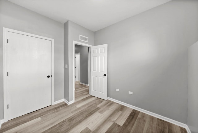 6139 S King Dr, Chicago, IL 60637 - unfurnished bedroom with wood finished floors and baseboards