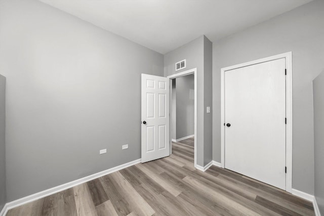 6139 S King Dr, Chicago, IL 60637 - unfurnished bedroom featuring wood finished floors and baseboards