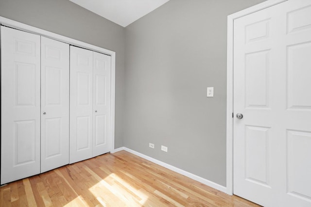 6139 S King Dr, Chicago, IL 60637 - unfurnished bedroom featuring light wood-style flooring and a closet