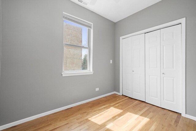 6139 S King Dr, Chicago, IL 60637 - unfurnished bedroom featuring light wood finished floors and a closet