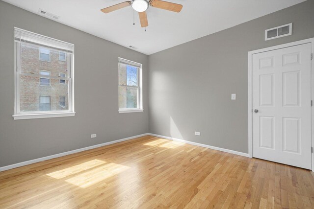 6139 S King Dr, Chicago, IL 60637 - empty room featuring light wood-type flooring and ceiling fan