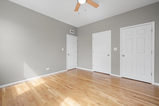 6139 S King Dr, Chicago, IL 60637 - unfurnished bedroom with light wood finished floors and a ceiling fan