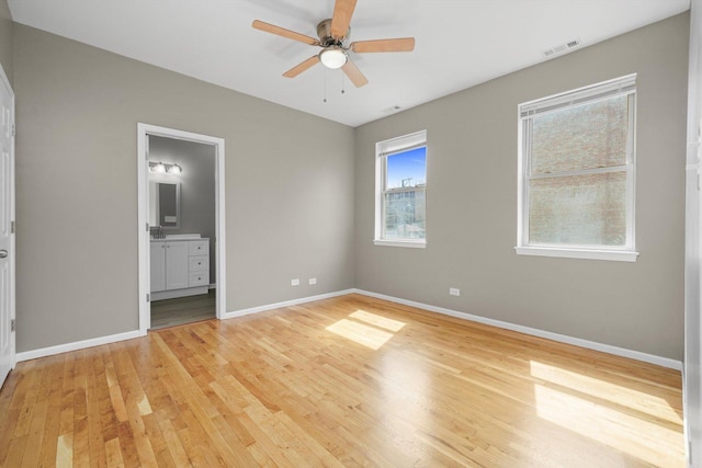 6139 S King Dr, Chicago, IL 60637 - unfurnished bedroom with light wood finished floors, ensuite bathroom, and ceiling fan