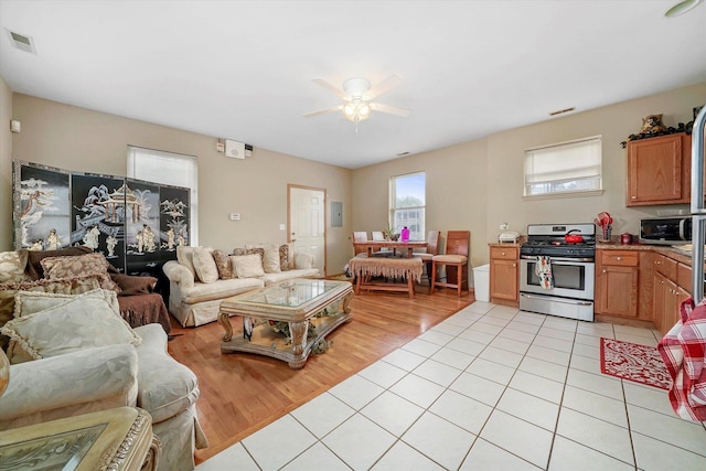 6139 S King Dr, Chicago, IL 60637 - living area featuring ceiling fan and light tile patterned floors
