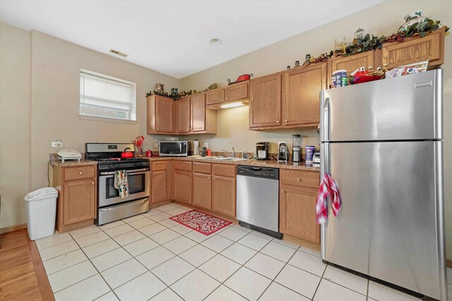 6139 S King Dr, Chicago, IL 60637 - kitchen with stainless steel appliances and light countertops