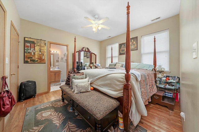 6139 S King Dr, Chicago, IL 60637 - bedroom with light wood-style flooring, ensuite bathroom, and ceiling fan